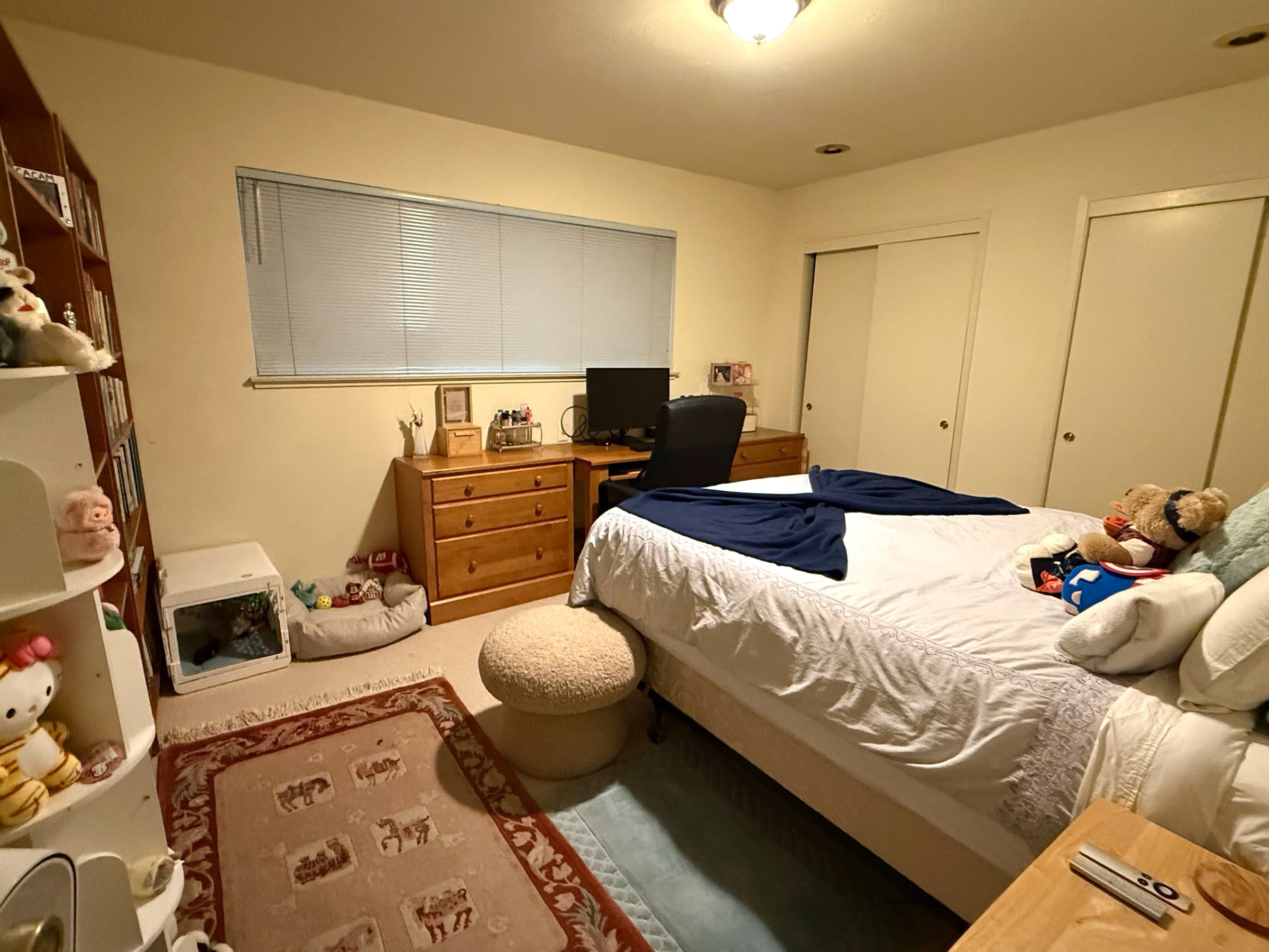 After: The same bedroom tidy, with the bed made and the floor clear