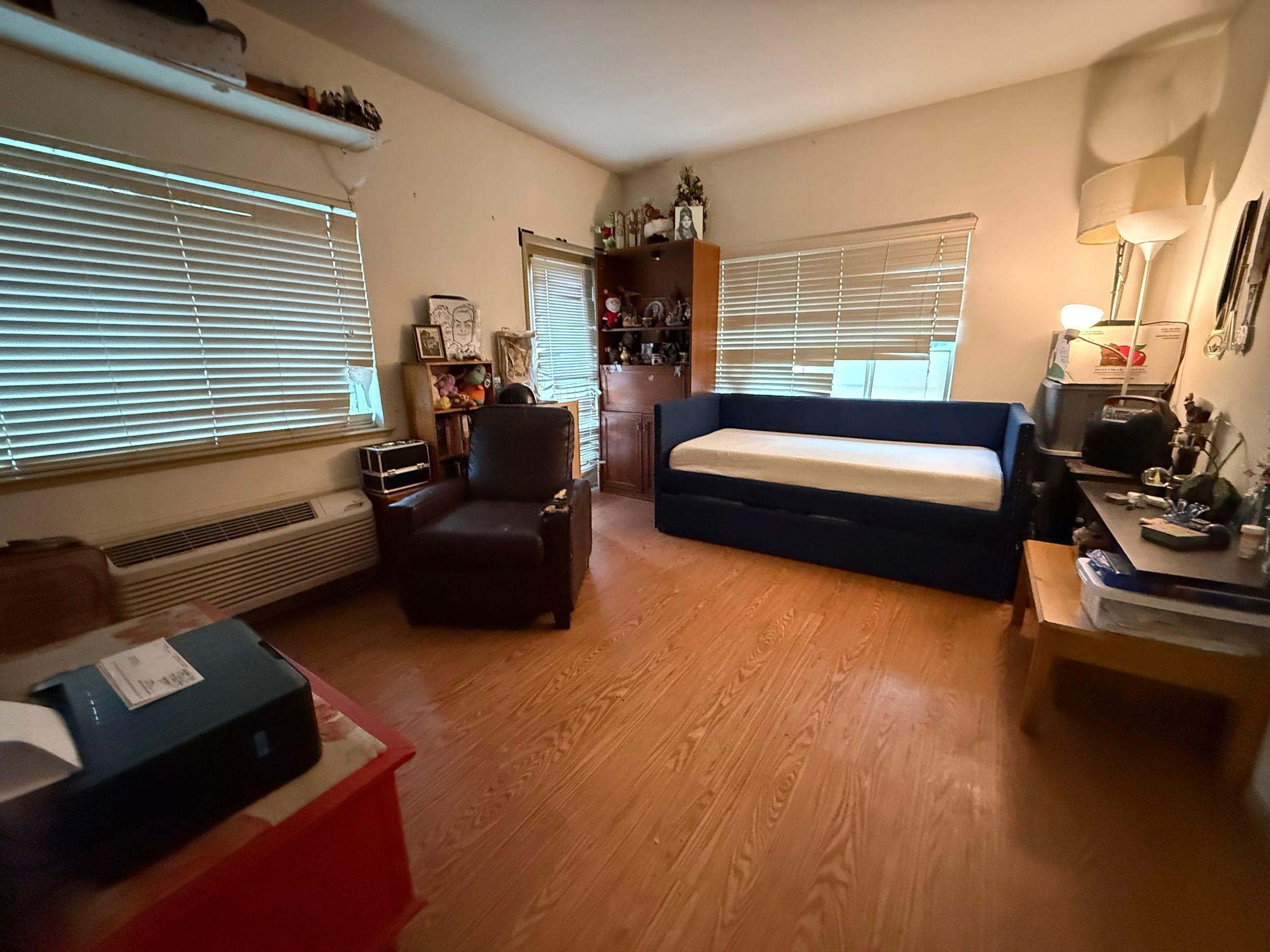 After: The same spare room cleared and organized with a made daybed