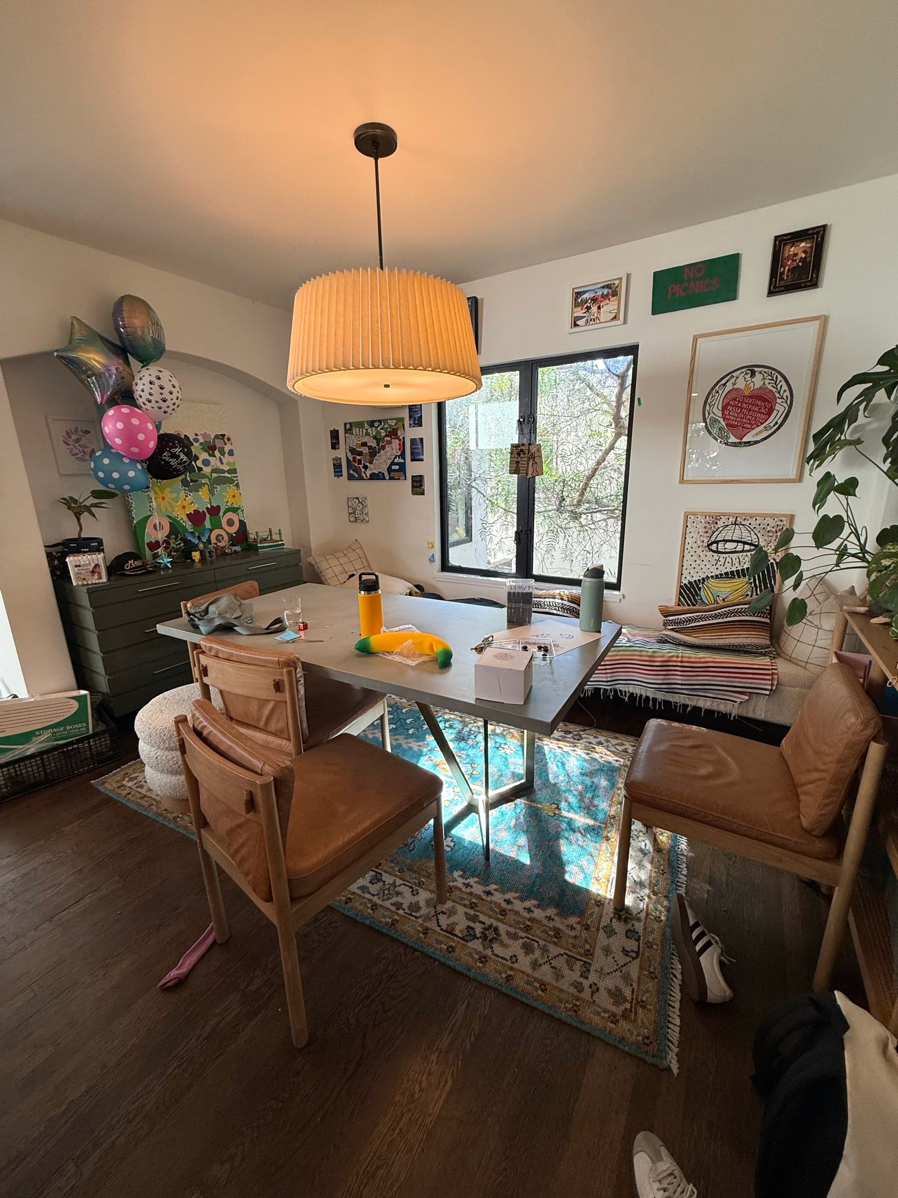 Before: Dining room after a party, with balloons, scattered chairs and items on the table