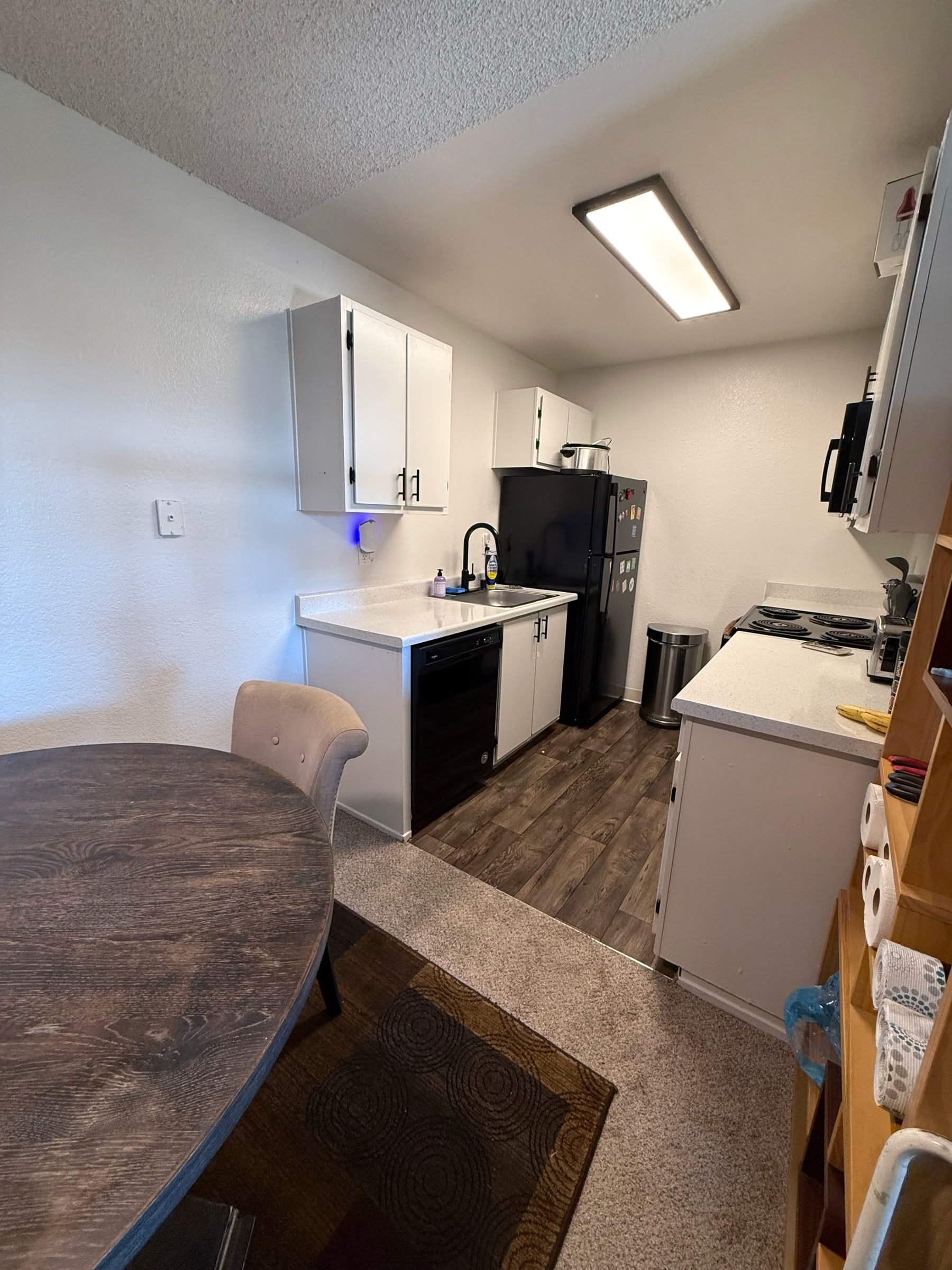 After: The same kitchen fully unpacked with clean counters and floor
